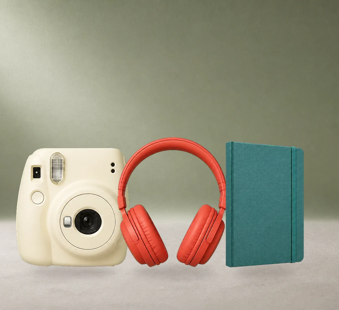 A creative studio scene separated into a clean background and transparent instant camera, headphones, and sketchbook layers