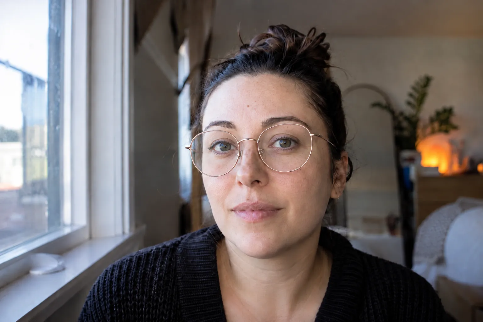 The same portrait after removing the glare from the glasses, with both eyes clearly visible.