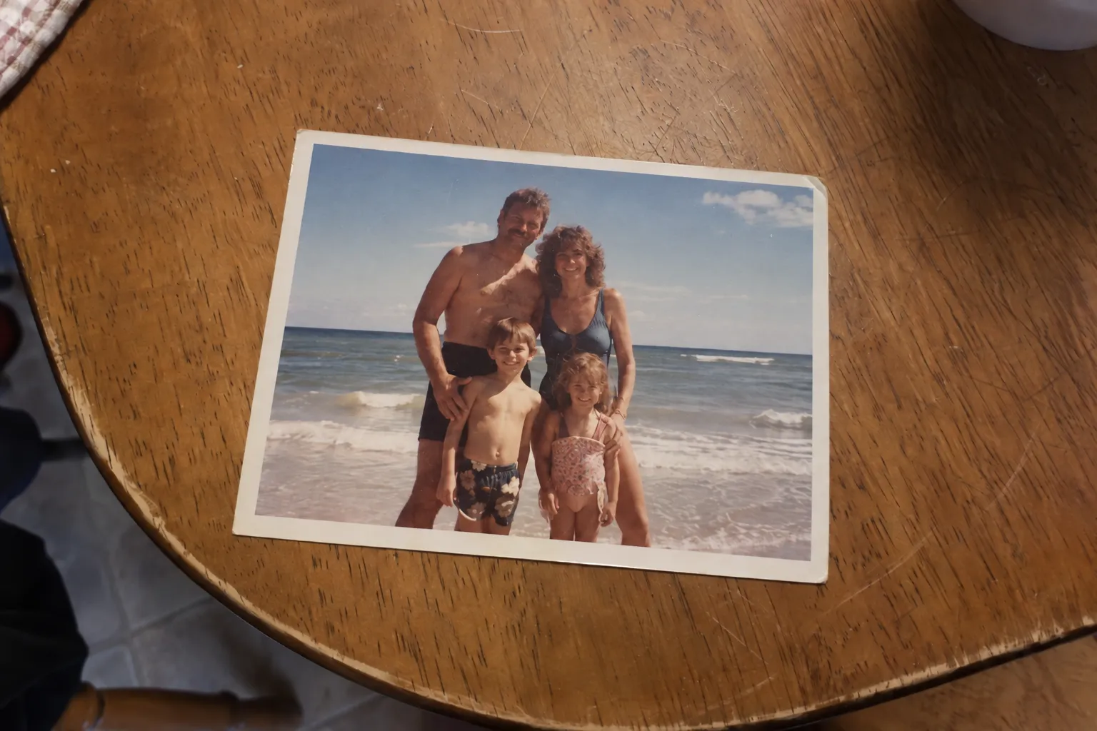 The same vintage print with the lamp glare removed and the family visible again.